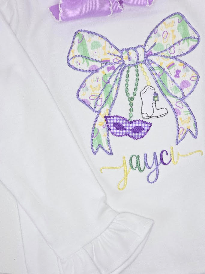 Embroidered design on a white fabric with a bow, boot, and sunglasses, featuring the name 'Jayci'.