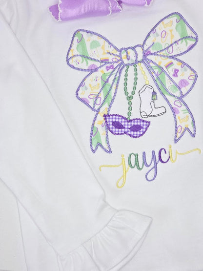 Embroidered design on a white fabric with a bow, boot, and sunglasses, featuring the name 'Jayci'.