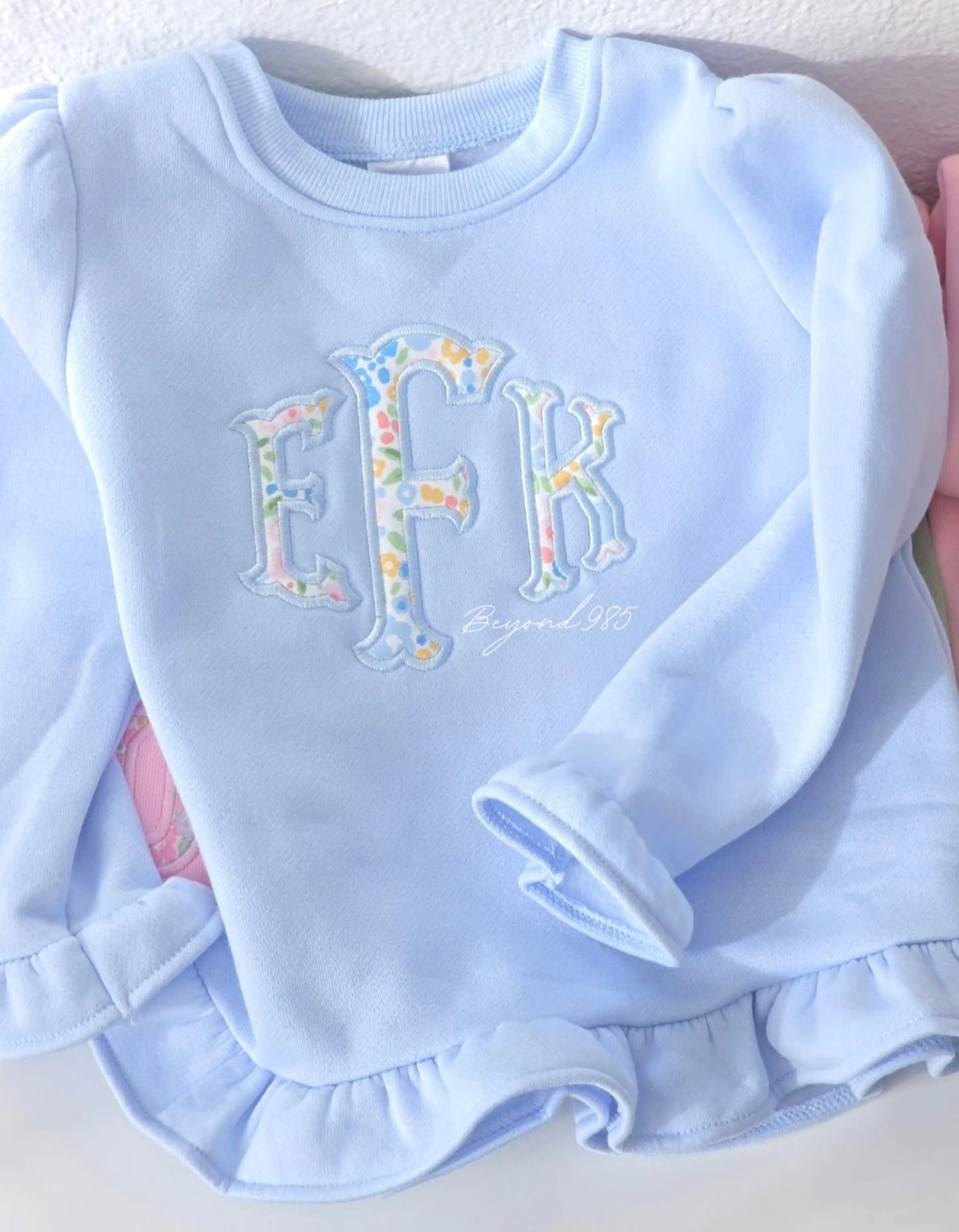 Girls Ruffle Bottom Sweatshirt with Pockets