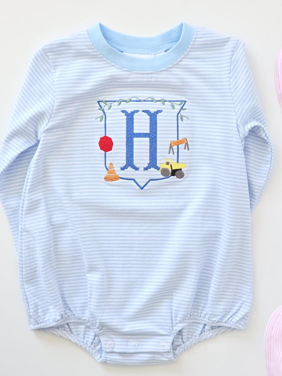 Personalized boys blue stripe construction bubble romper with embroidered monogram and construction truck design