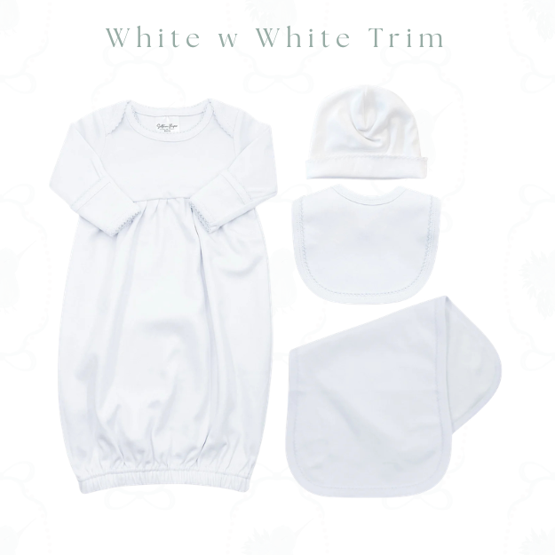 A white baby gift set featuring a long-sleeve sleep sack, a beanie hat, a bib, and a cloth diaper, all laid out on a white background with the text 'White w White Trim' at the top.
